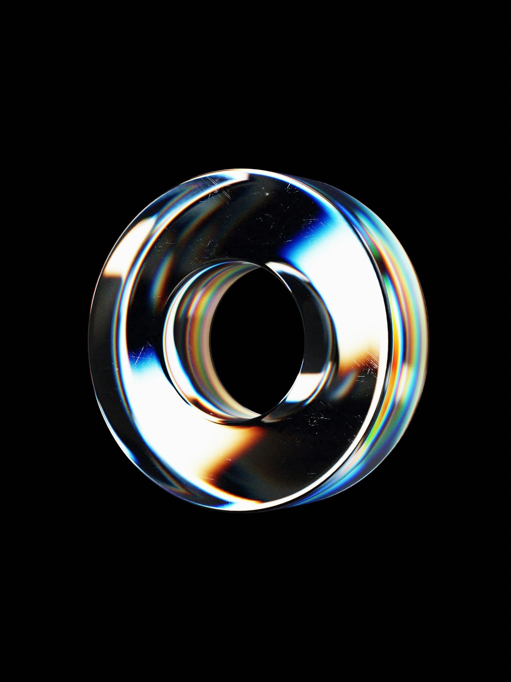 An iridescent metallic ring on a black background